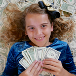 girl holding some money